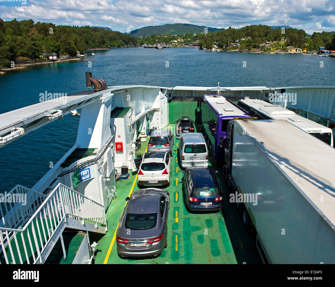 Ferry carrying vehicles approaching the ferry port of Halhjem, Hordaland, Norway Stock Photo