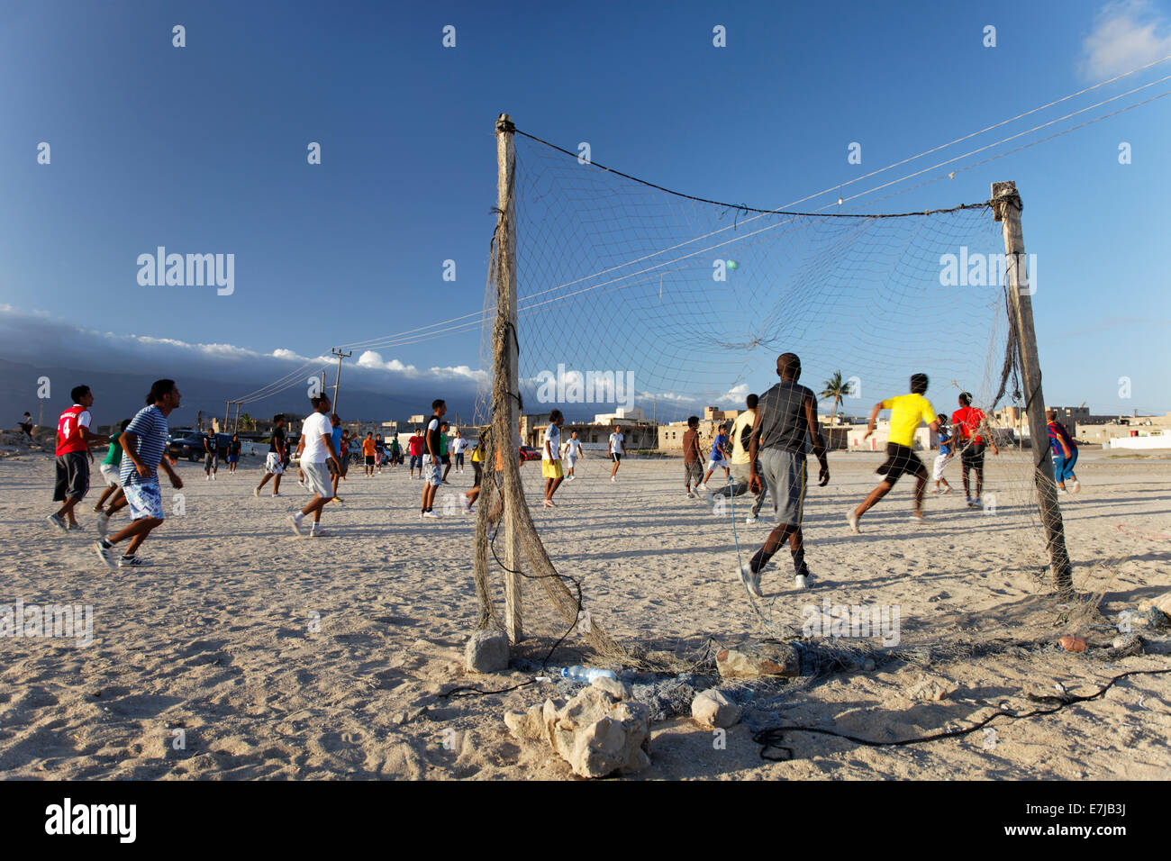 Omanis playing football, Mirbat, Dhofar region, Sultanate of Oman, Arabian Peninsula Stock Photo