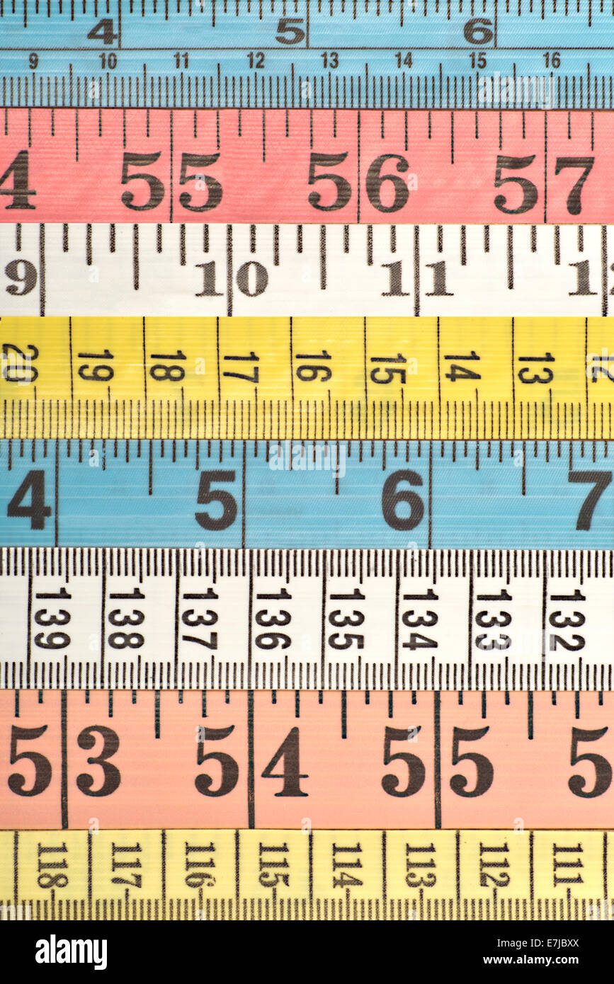 Various colourful measuring tapes Stock Photo