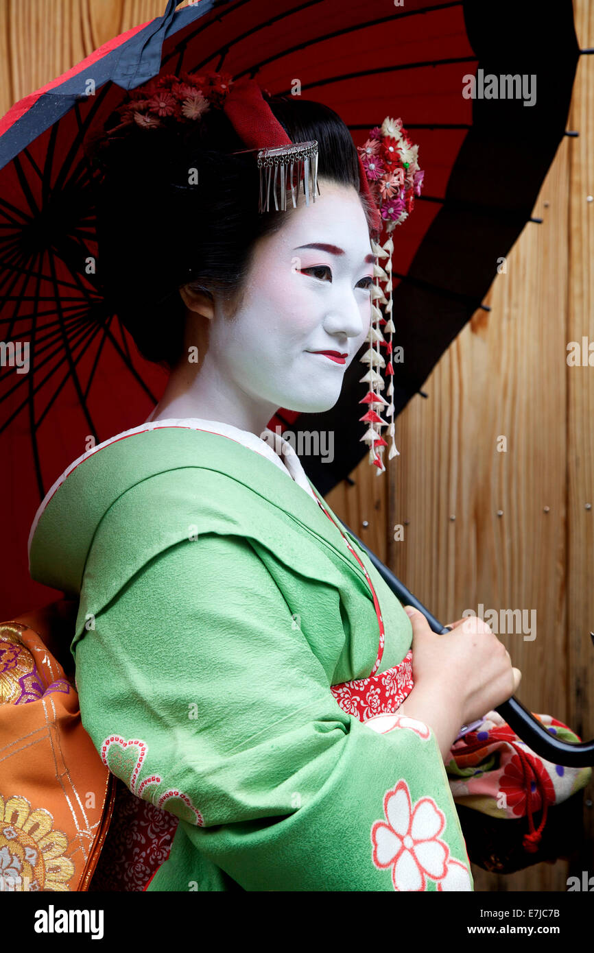Japanese woman portrait, female beauty, geisha smiling, Gion area, Kyoto, Japan, Asia. Traditional geishas make up and dress Stock Photo