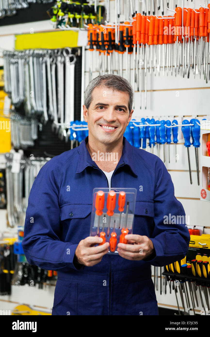 Scrowdriver Package Confident Worker Holding Screwdriver Package Stock Photo - Alamy