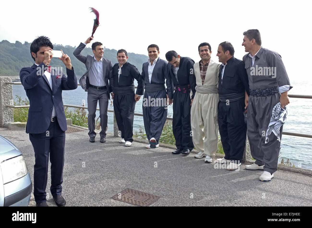 A group of Kurdistani men celebrate their friends forthcoming marriage. Groom is the furthest right in this picture. Stock Photo