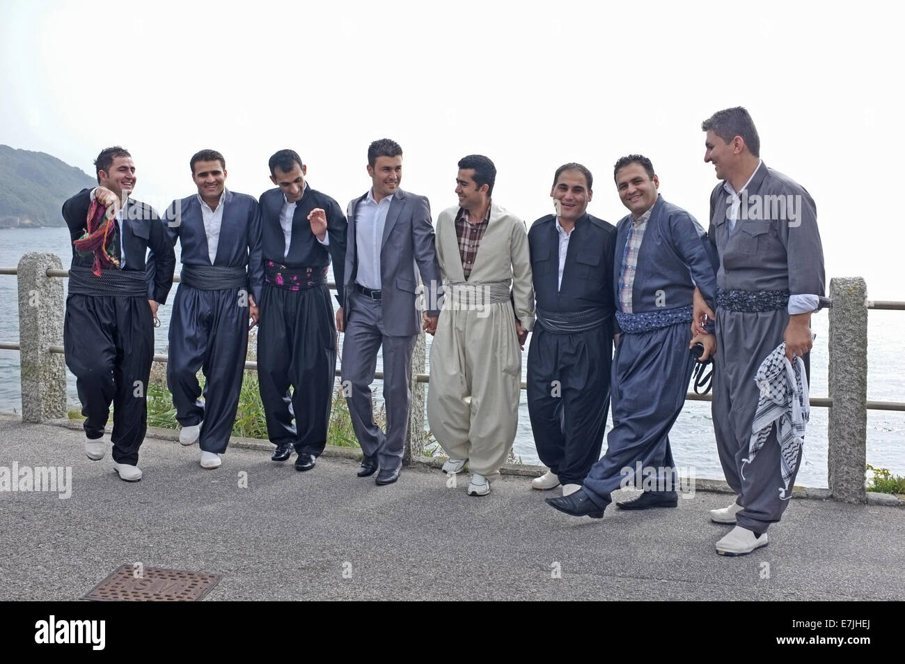 A group of Kurdistani men celebrate their friends forthcoming marriage. Groom is the furthest right in this picture. Stock Photo