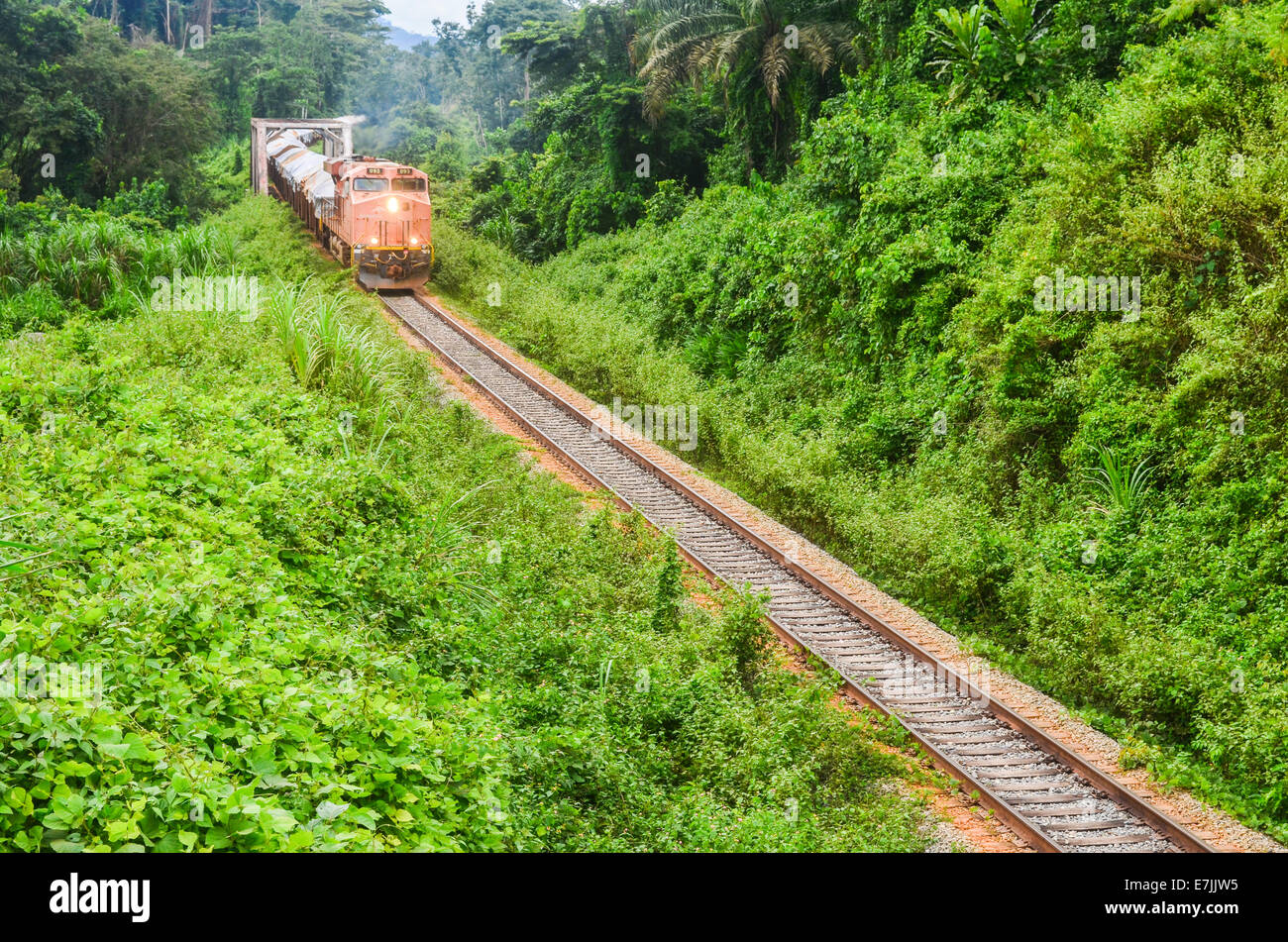 A freight train from ArcelorMittal carrying iron ore from the Nimba deposit to the port of Buchanan, Liberia Stock Photo