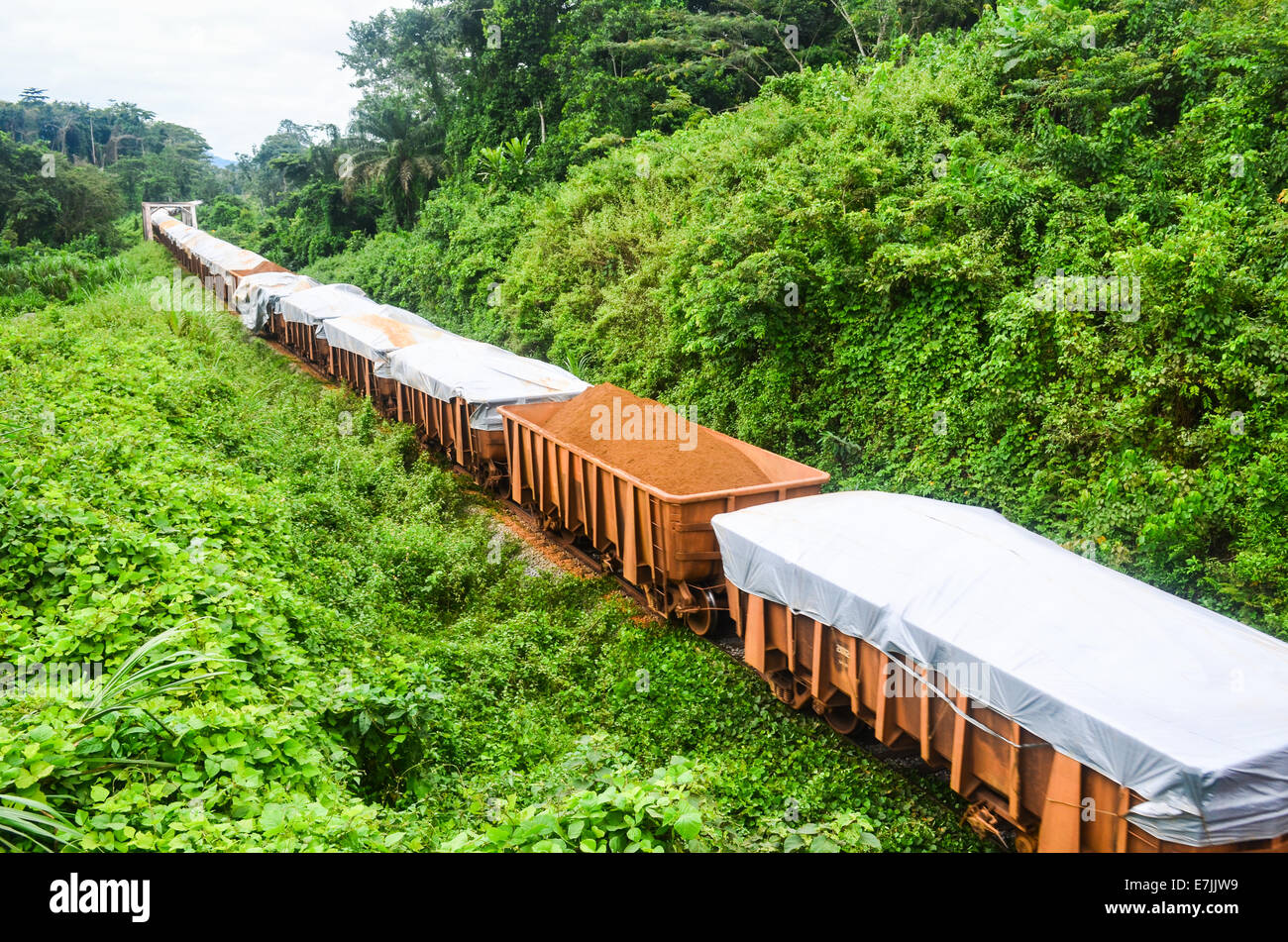 A freight train from ArcelorMittal carrying iron ore from the Nimba deposit to the port of Buchanan, Liberia Stock Photo