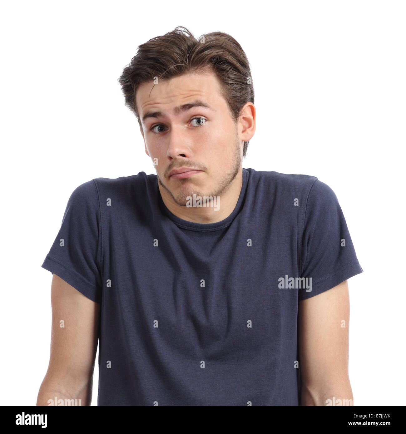 Front portrait of a young man doubting shrugging shoulders isolated on a white background Stock Photo