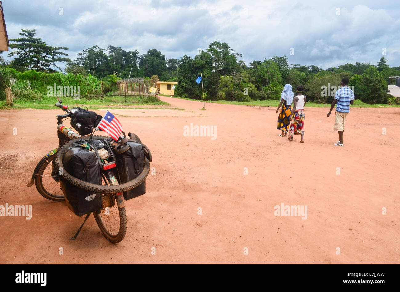 African people about to cross the border from Liberia to Ivory Coast (Côte d'Ivoire) Stock Photo