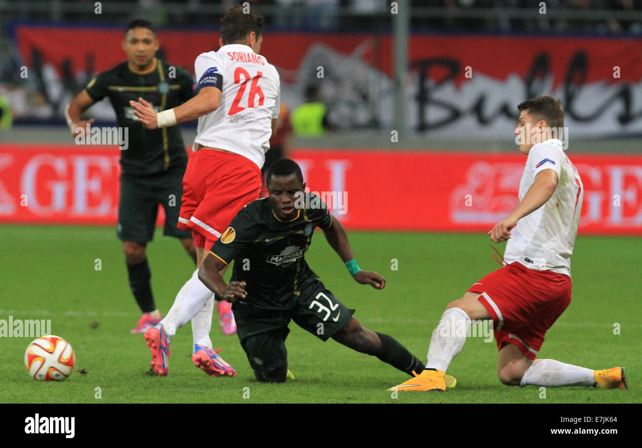Salzburg, Austria. 18th Sep, 2014. Salzburg's Jonatan Soriano (l) and Marcel Sabitzer (r) vies for the ball with Celtic's Mubarak Wakaso during the Europa League soccer match between Red Bull Salzburg vs FC Celtic Glasgow in Salzburg, Austria, 18 September 2014. Credit:  dpa picture alliance/Alamy Live News Stock Photo