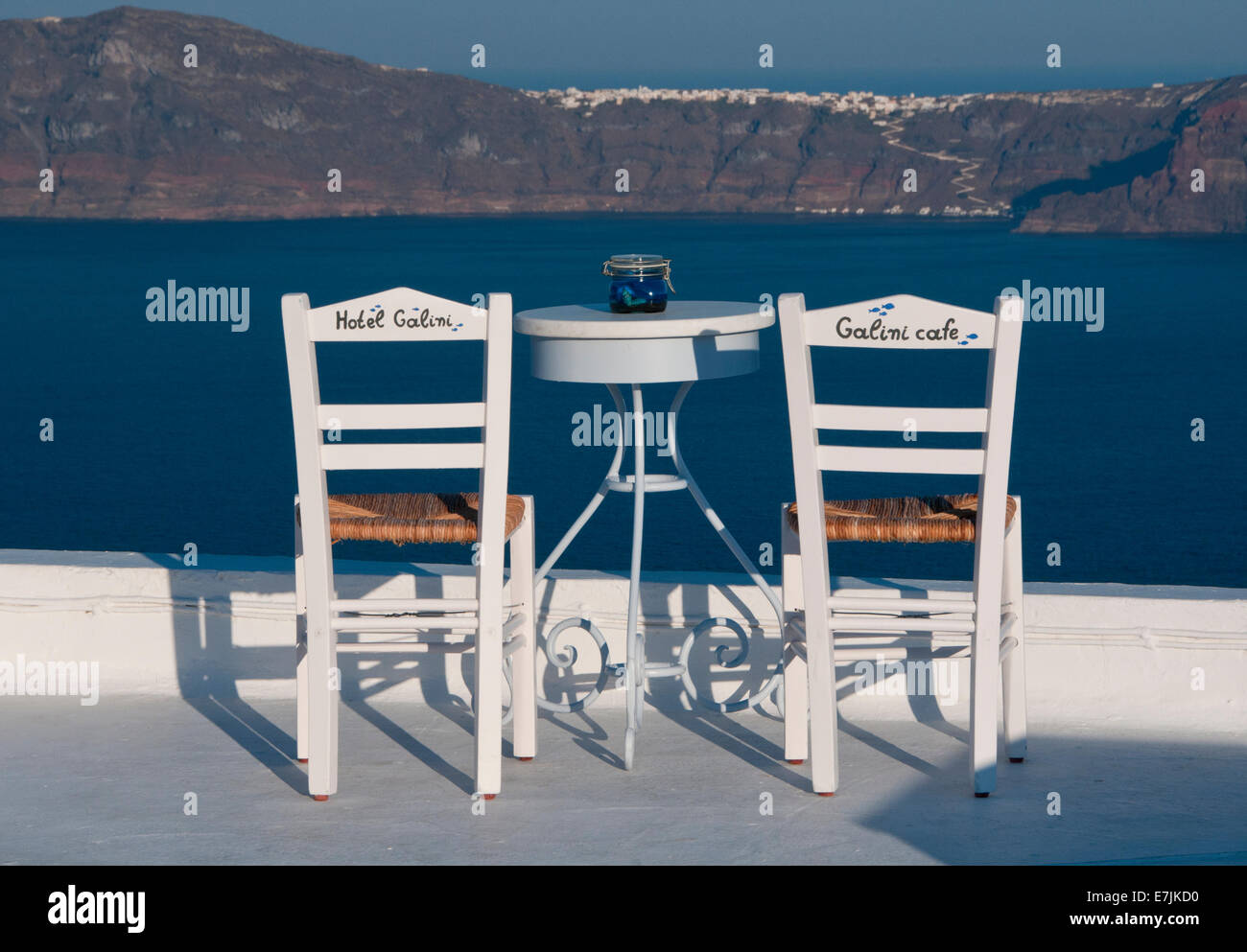 Hotel Galini Table & Chairs overlooking The Caldera,  Firostefani, Santorini, Cyclades, Greek Islands, Greece, Europe Stock Photo