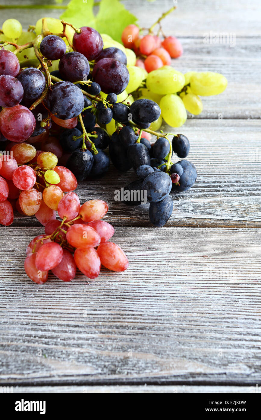 Different types of grapes on the boards, closeup Stock Photo - Alamy