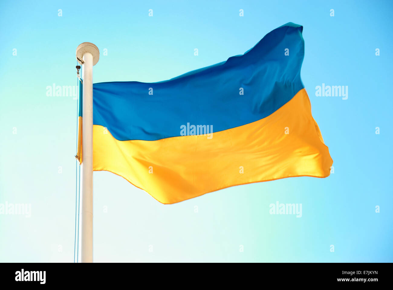 Ukrainian blue and yellow flag on the sky background Stock Photo