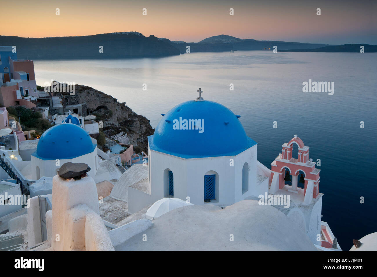 Blue Domed Churches Overlooking The Caldera, Oia, Santorini, Cyclades, Greek Islands, Greece, Europe Stock Photo
