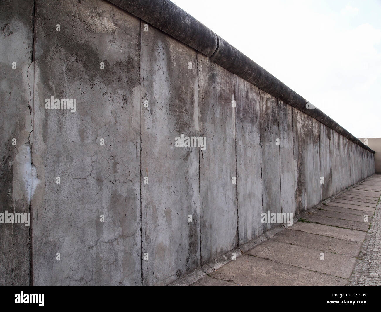 An original part of the Berlin wall that once divided East from West Berlin that has been preserved as 'Berlin wall memorial' Stock Photo
