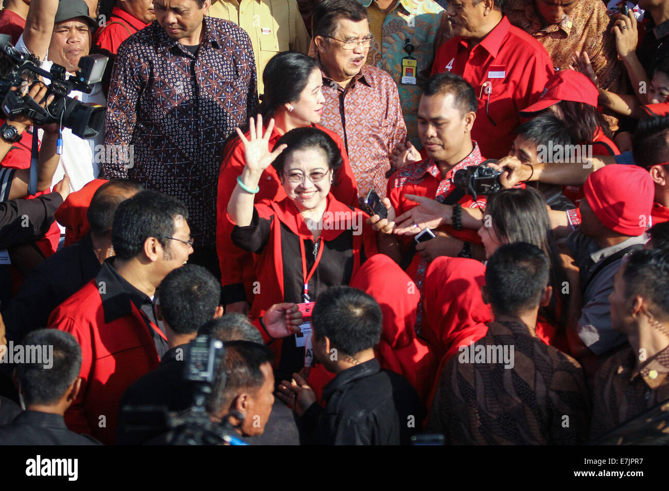 Semarang, Indonesia. 19th September, 2014. Former president and chairperson of Indonesian Democratic Party of Struggle (PDI-P) Megawati Sukarnoputri waves her hand to supporters during the 4th national working meeting of PDI-P at Marina Convention Hall in Semarang, Central Java, Indonesia. The national meeting attended by 1,590 party cadres from all over Indonesia and take place from 19-21 September 2014. The meeting is expected to change the 10-year mindset of the PDI-P, as it has switched to being the ruling party from being the opposition party. Credit:  PACIFIC PRESS/Alamy Live News Stock Photo
