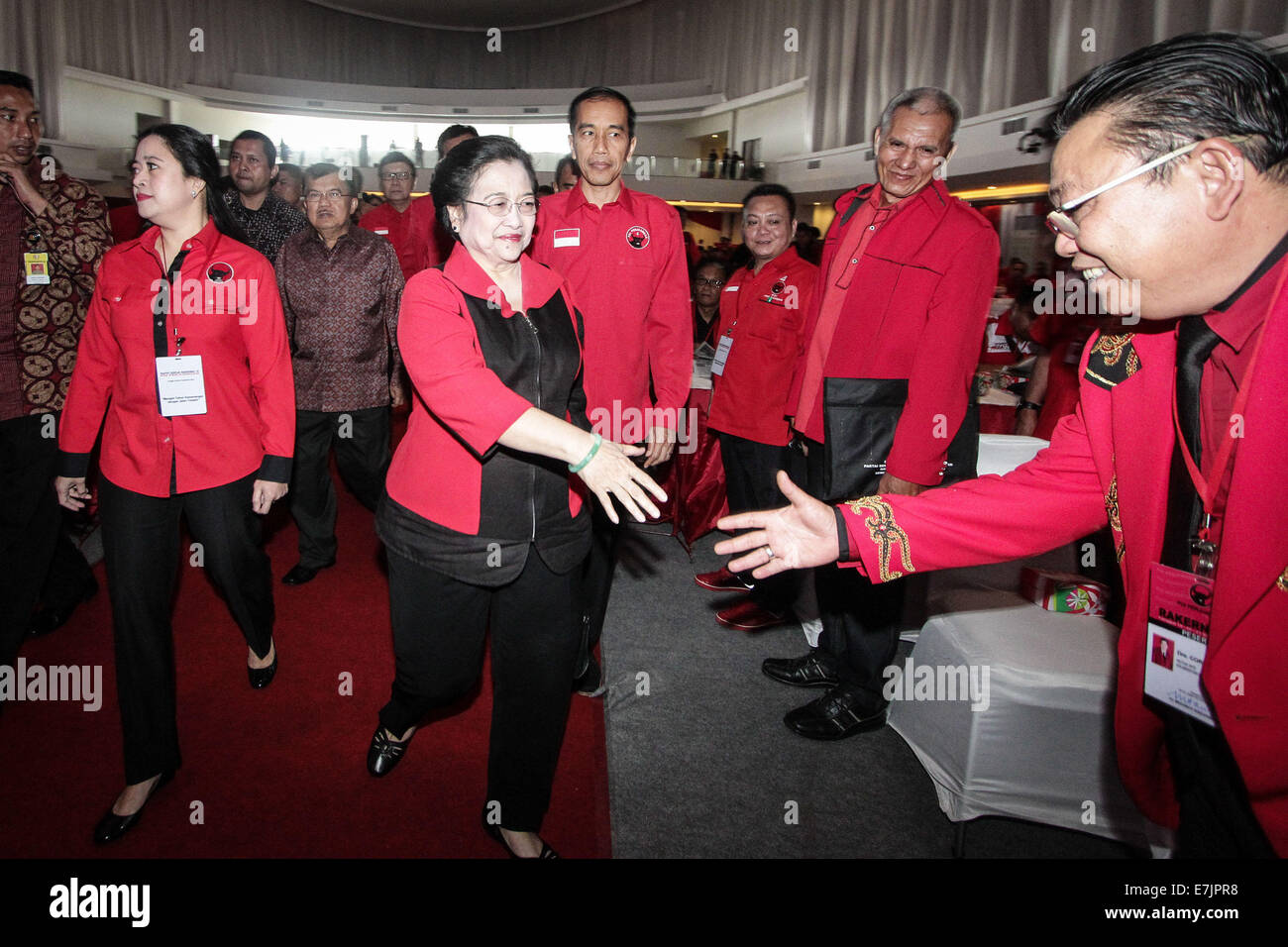 Semarang, Indonesia. 19th September, 2014. Former president and chairperson of Indonesian Democratic Party of Struggle (PDI-P) Megawati Sukarnoputri shake hand a cadre during the 4th national working meeting of PDI-P at Marina Convention Hall in Semarang, Central Java, Indonesia. The national meeting attended by 1,590 party cadres from all over Indonesia and take place from 19-21 September 2014. The meeting is expected to change the 10-year mindset of the PDI-P, as it has switched to being the ruling party from being the opposition party. Credit:  PACIFIC PRESS/Alamy Live News Stock Photo
