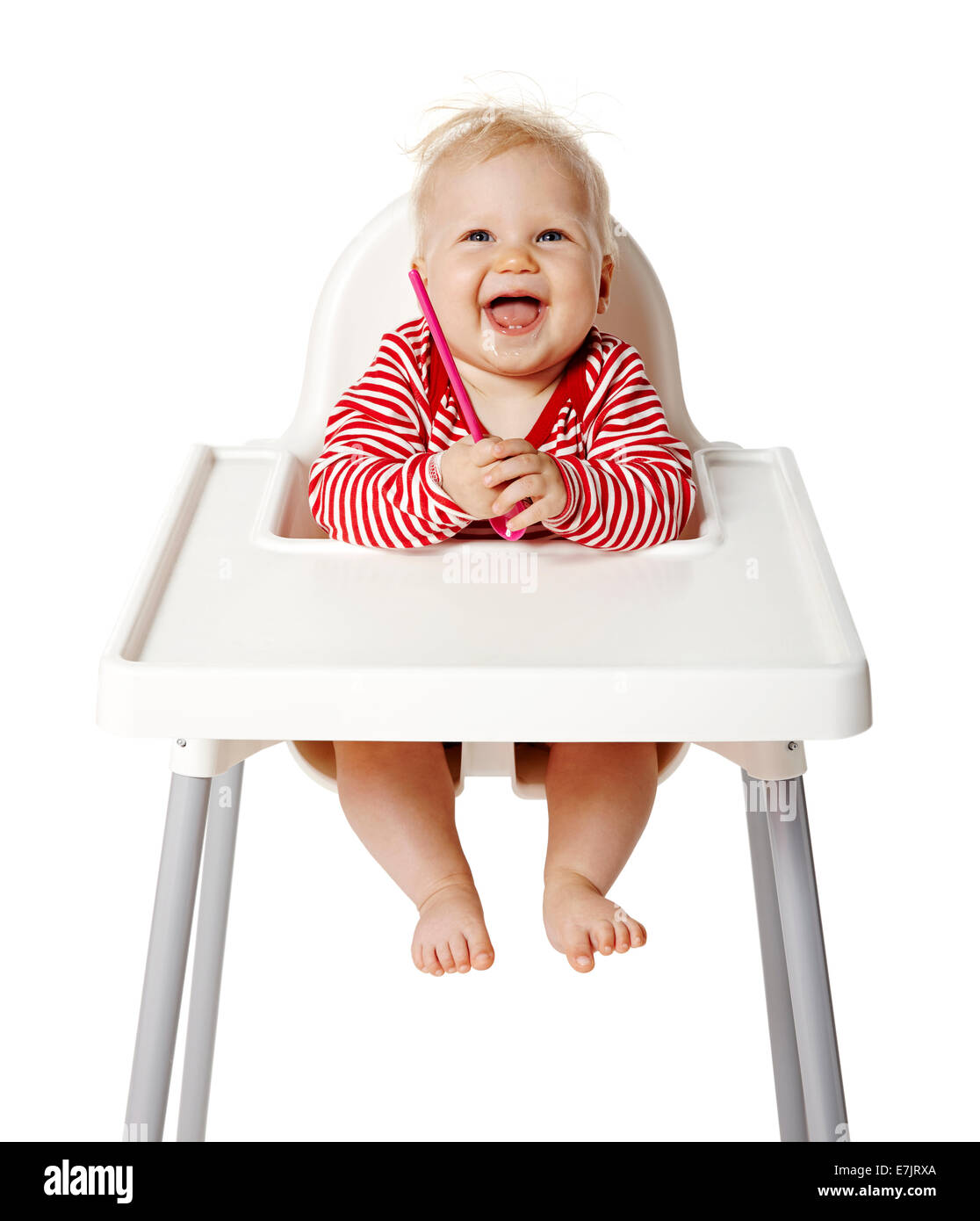 Baby sitting on chair and waiting for dinner. Isolated on white Background. Stock Photo