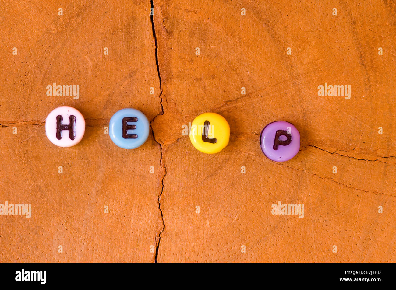 word help written with colorful letters on elegant wood background ...