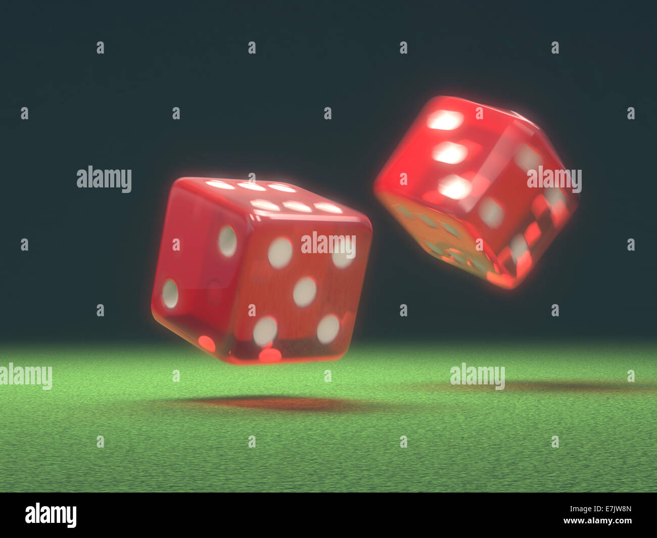 Two red dice thrown on green table. Stock Photo