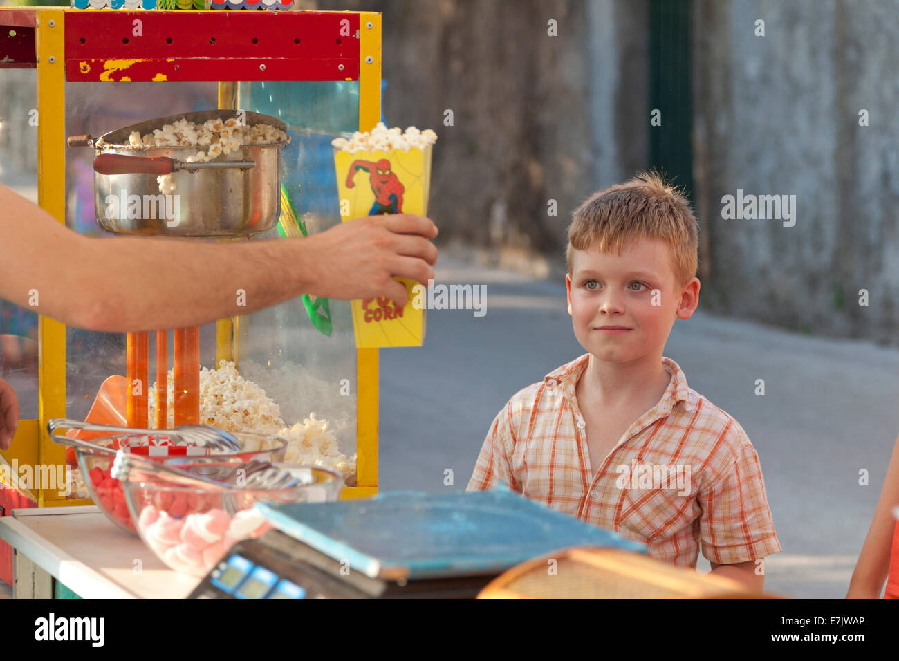 happy boy buying popcorn, Rabac, Istria, Croatia Stock Photo
