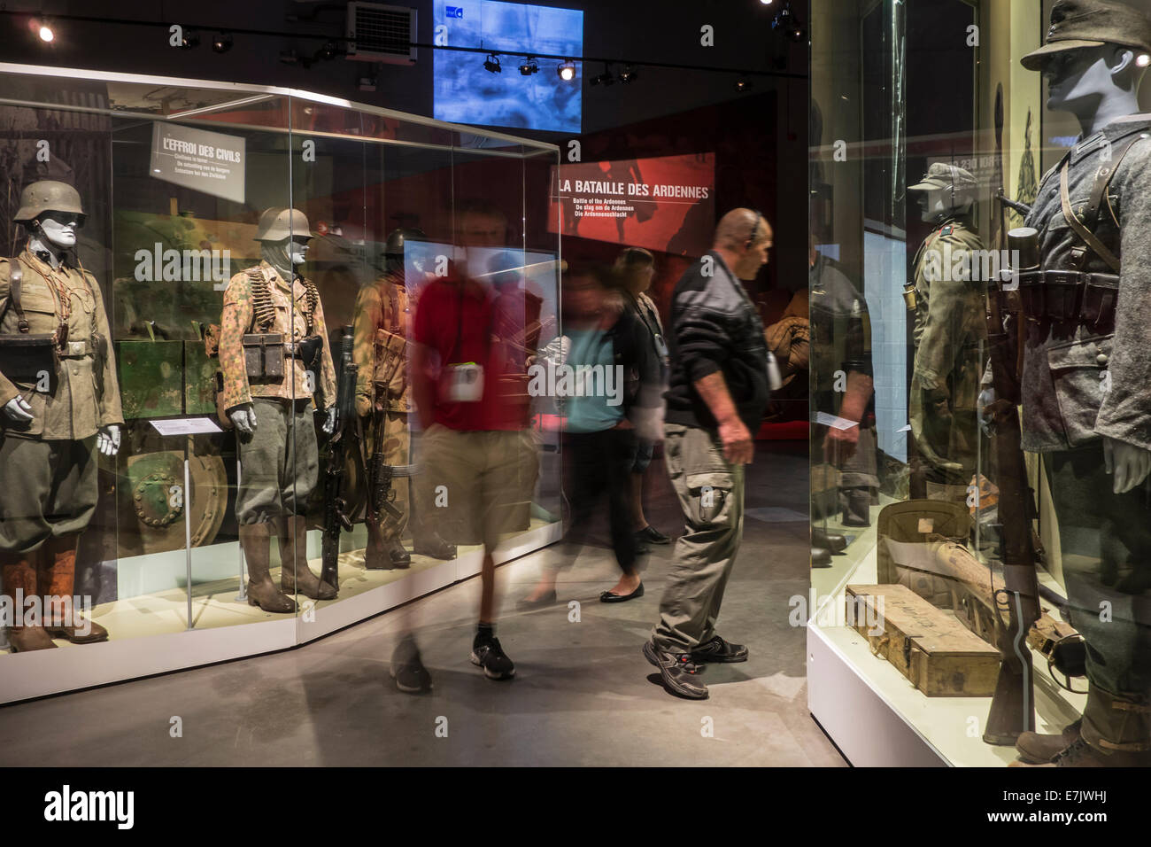 Tourists with audio guides visiting the Bastogne War Museum about World War Two Battle of the Bulge, Belgian Ardennes, Belgium Stock Photo