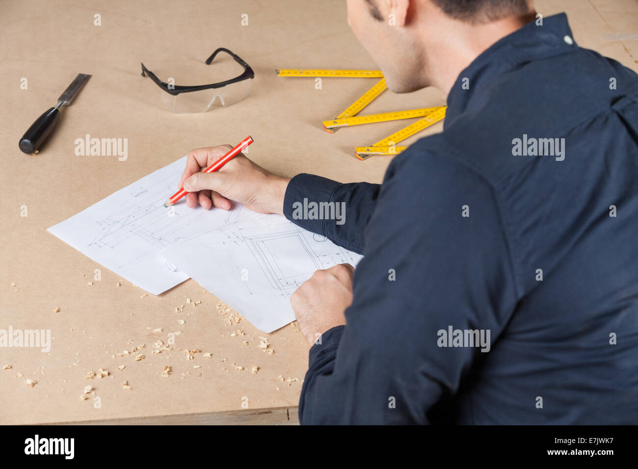 Architect Drawing Diagram At Table In Workshop Stock Photo - Alamy
