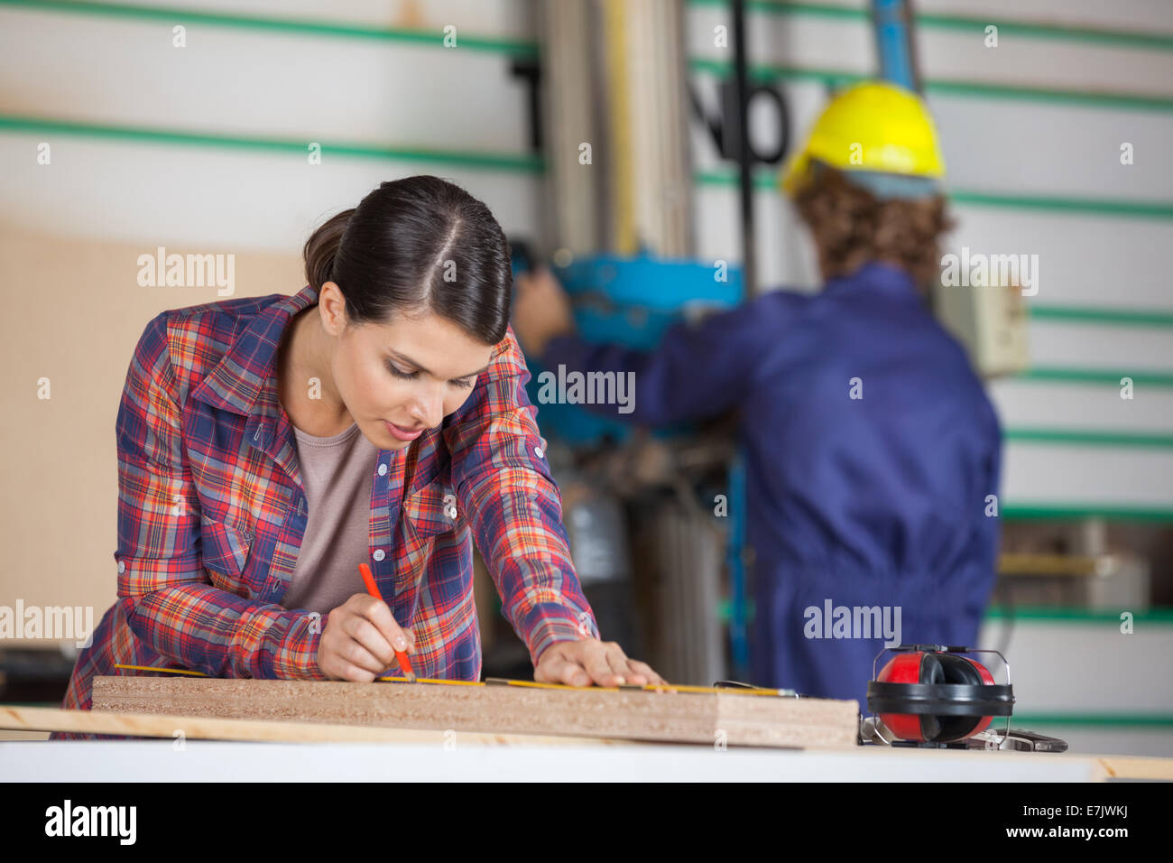 Carpenter Marking On Wood With Pencil Stock Photo Alamy