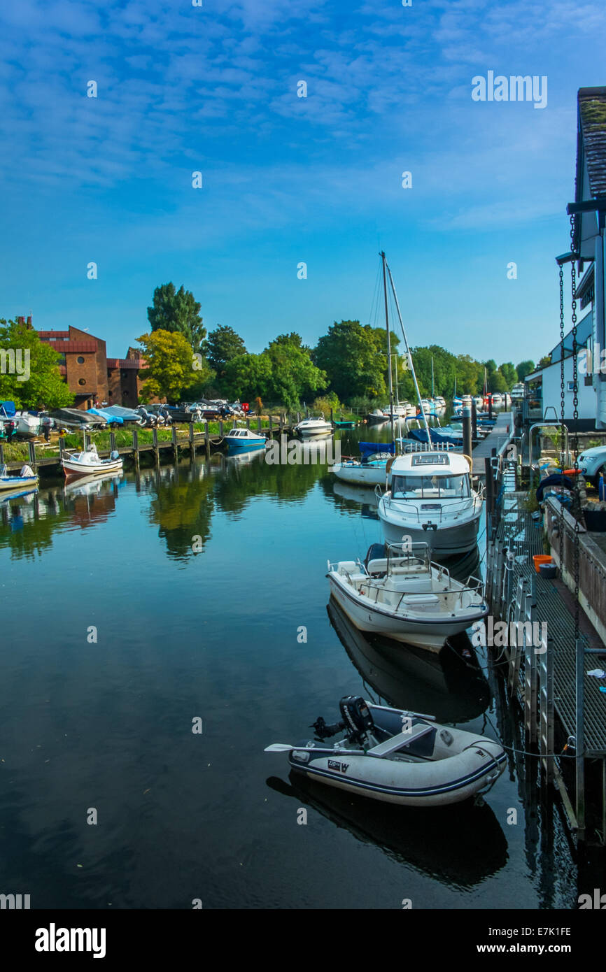 Moored boats on the river Avon Christchurch dorset in late summer Stock Photo
