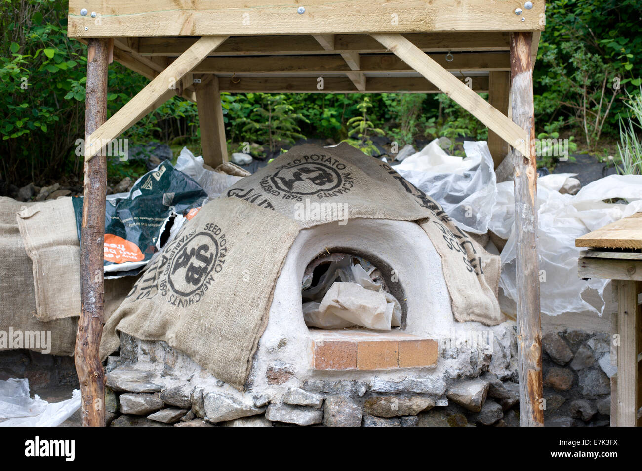 clay earth cob oven project. now the oven is complete and the lime
