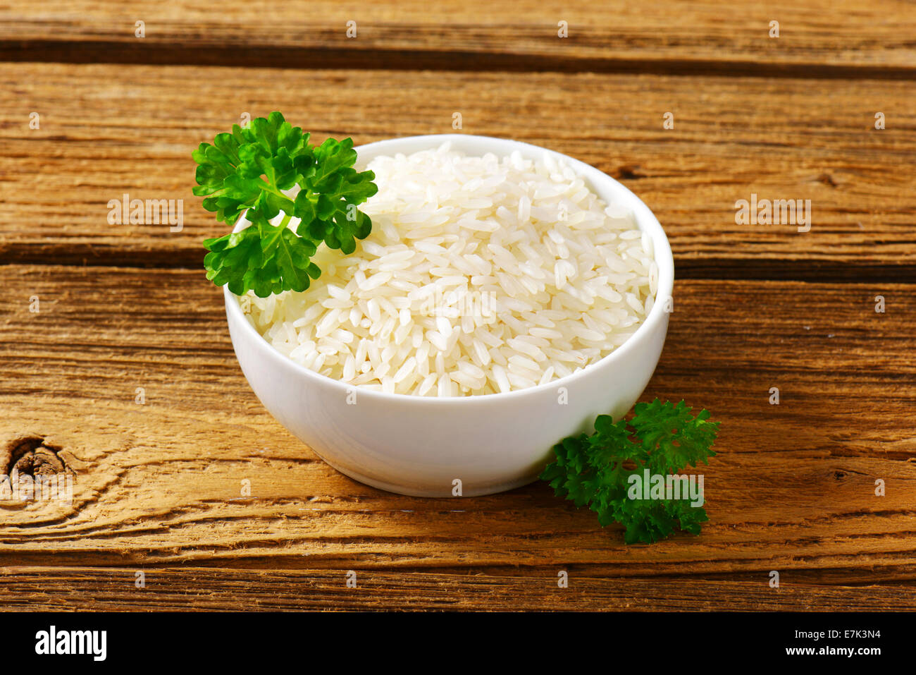 Bowl of uncooked white rice Stock Photo Alamy