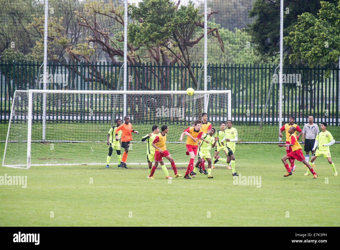 Youth football players challenging for the ball in front of the goal, Cape Town, South Africa