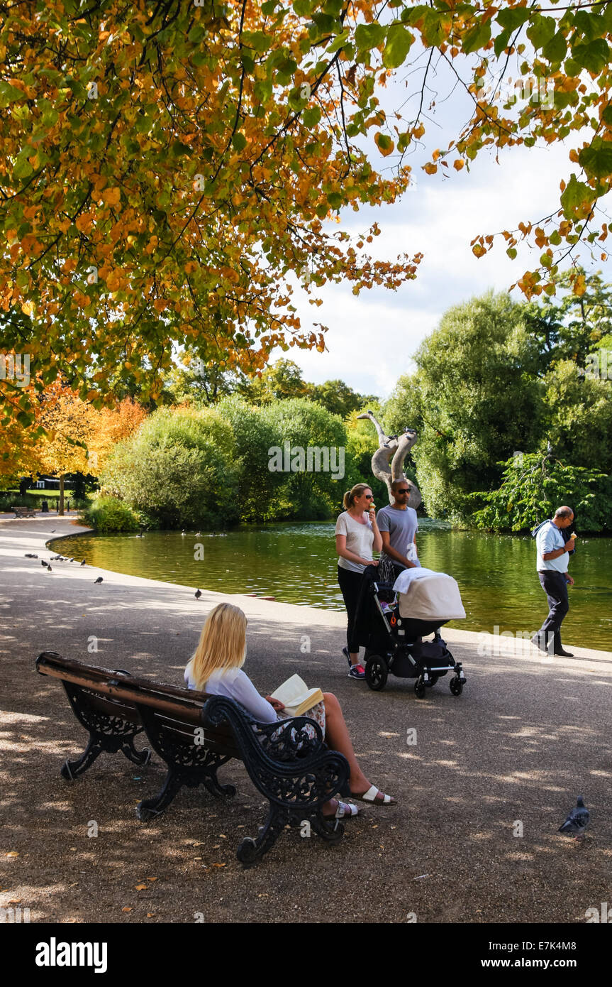 Visitors enjoy late summer colours in Victoria Park, London England United Kingdom UK Stock Photo