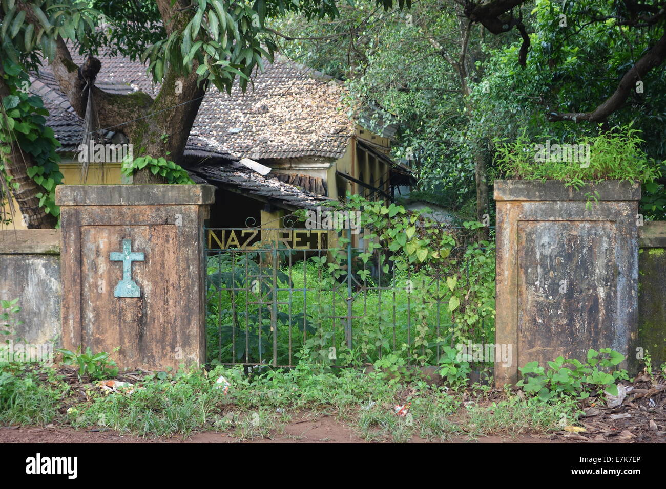 Old iron gate with a cross Stock Photo