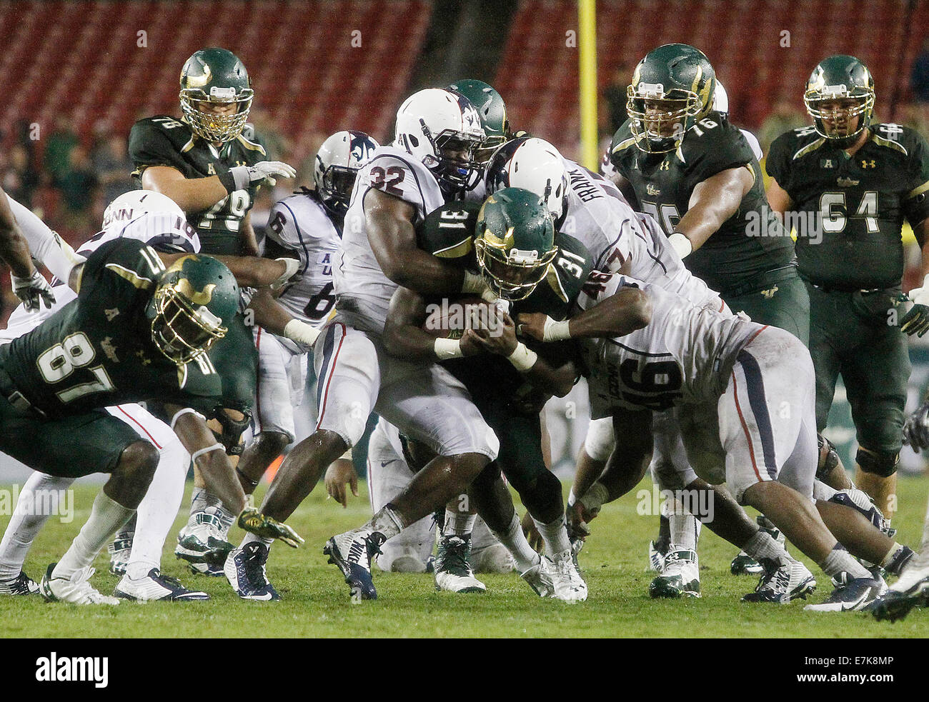 Sept. 19, 2014 - City, Florida, U.S. - OCTAVIO JONES | Times .South Florida Bulls running back Darius Tice (31) carries the Connecticut Huskies defense while getting the first down during the third quarter at Raymond James Stadium in Tampa on Friday, September 19, 2014. South Florida defeated the Connecticut Huskies 17 to 14. (Credit Image: © Octavio Jones/Tampa Bay Times/ZUMA Wire) Stock Photo