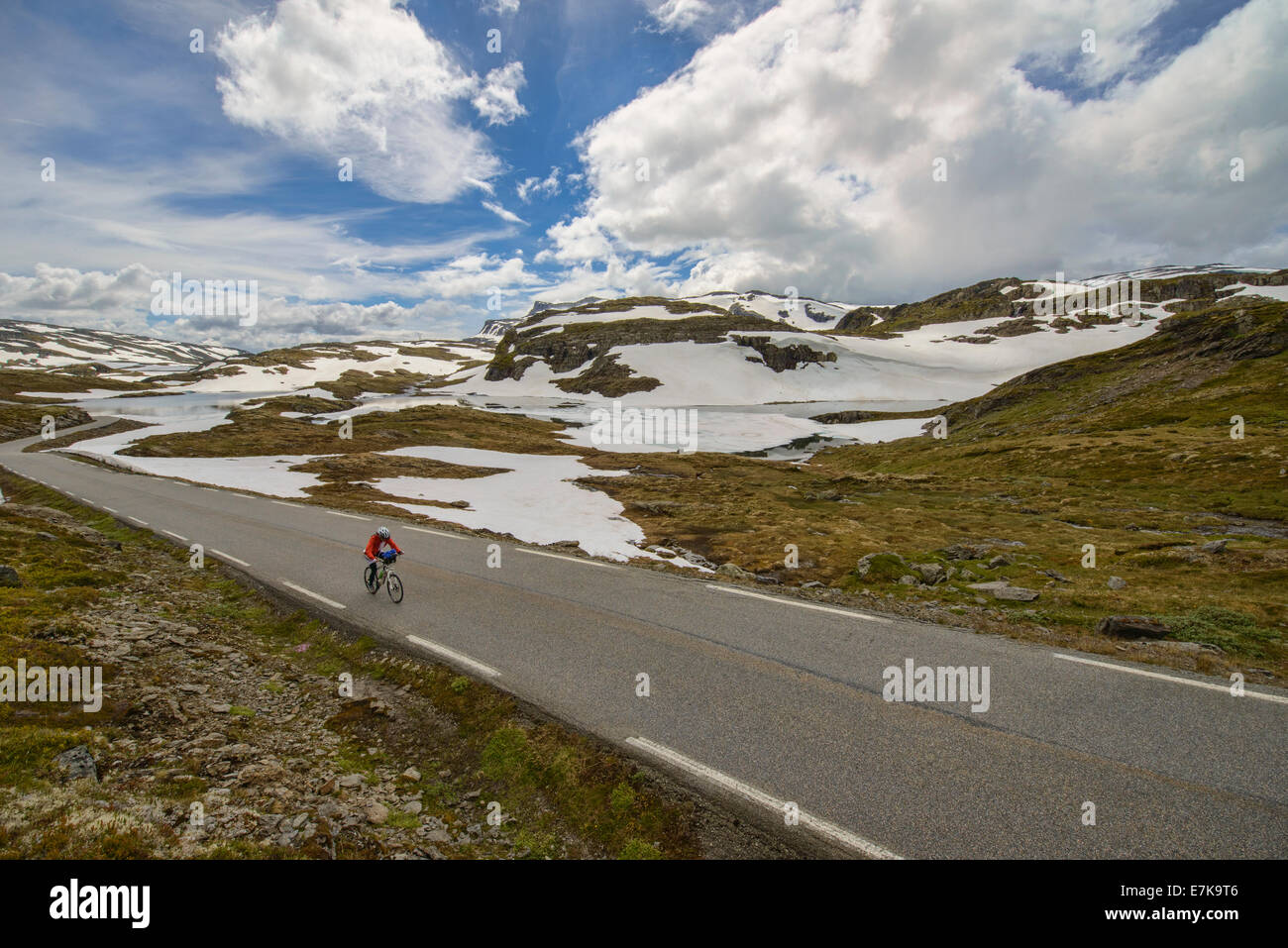 bicyclist on the Aurlandsvegen mountain road, Norway Stock Photo