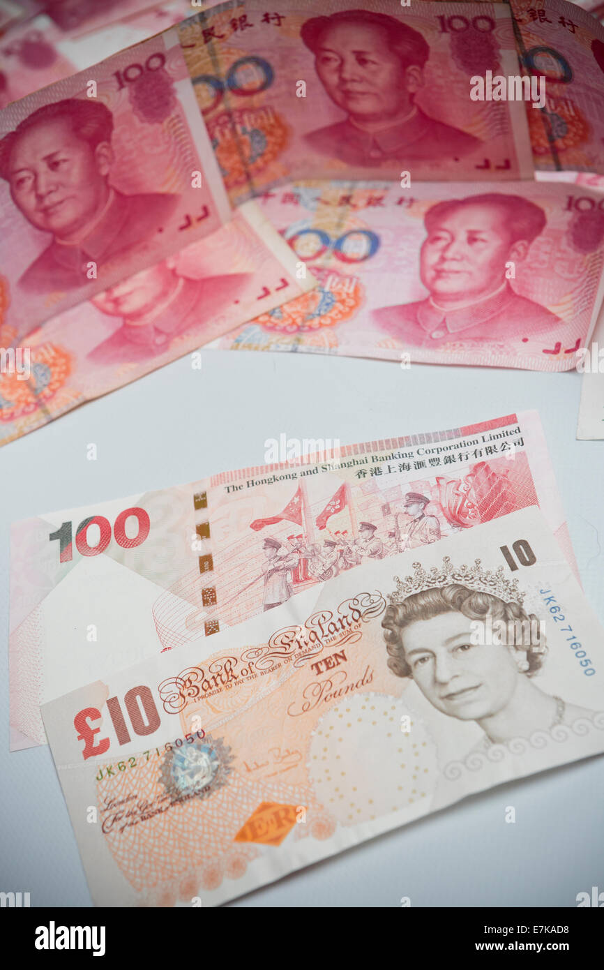 Hong Kong Dollar Pound Sterling Renminbi Yuan money travel currency trade embargo sovereignty wealth UK China globalisation Duty Tax Globe Stock Photo