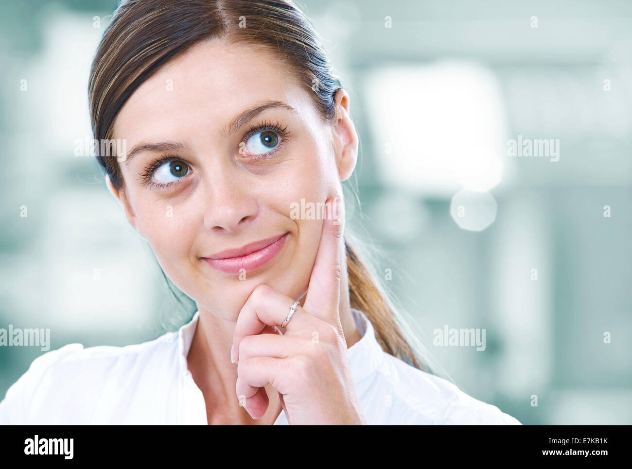 Portrait of young pretty woman in business environment Stock Photo - Alamy