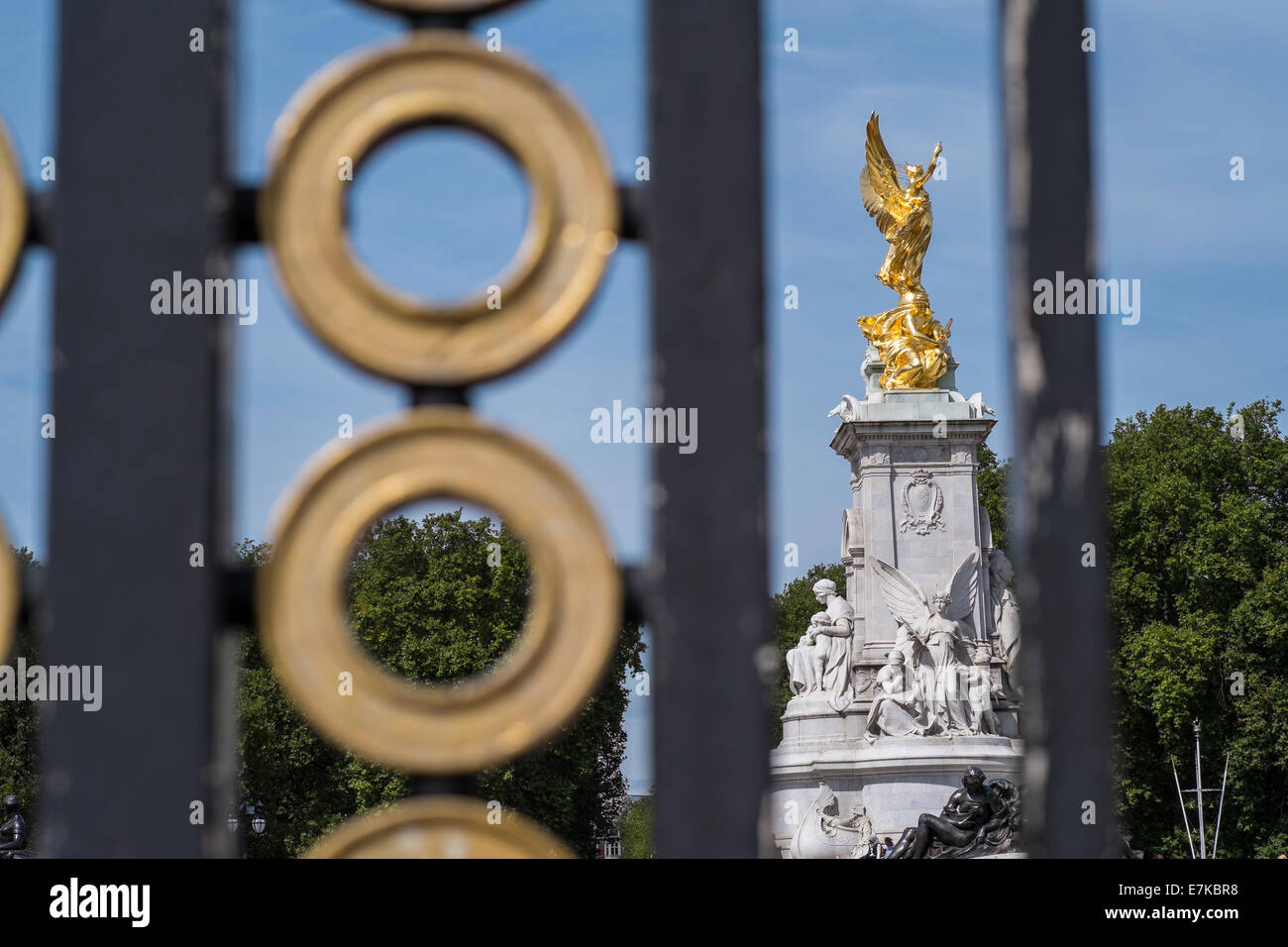 The Victoria Memorial seen through gates near Buckingham Palace on a summers day Stock Photo