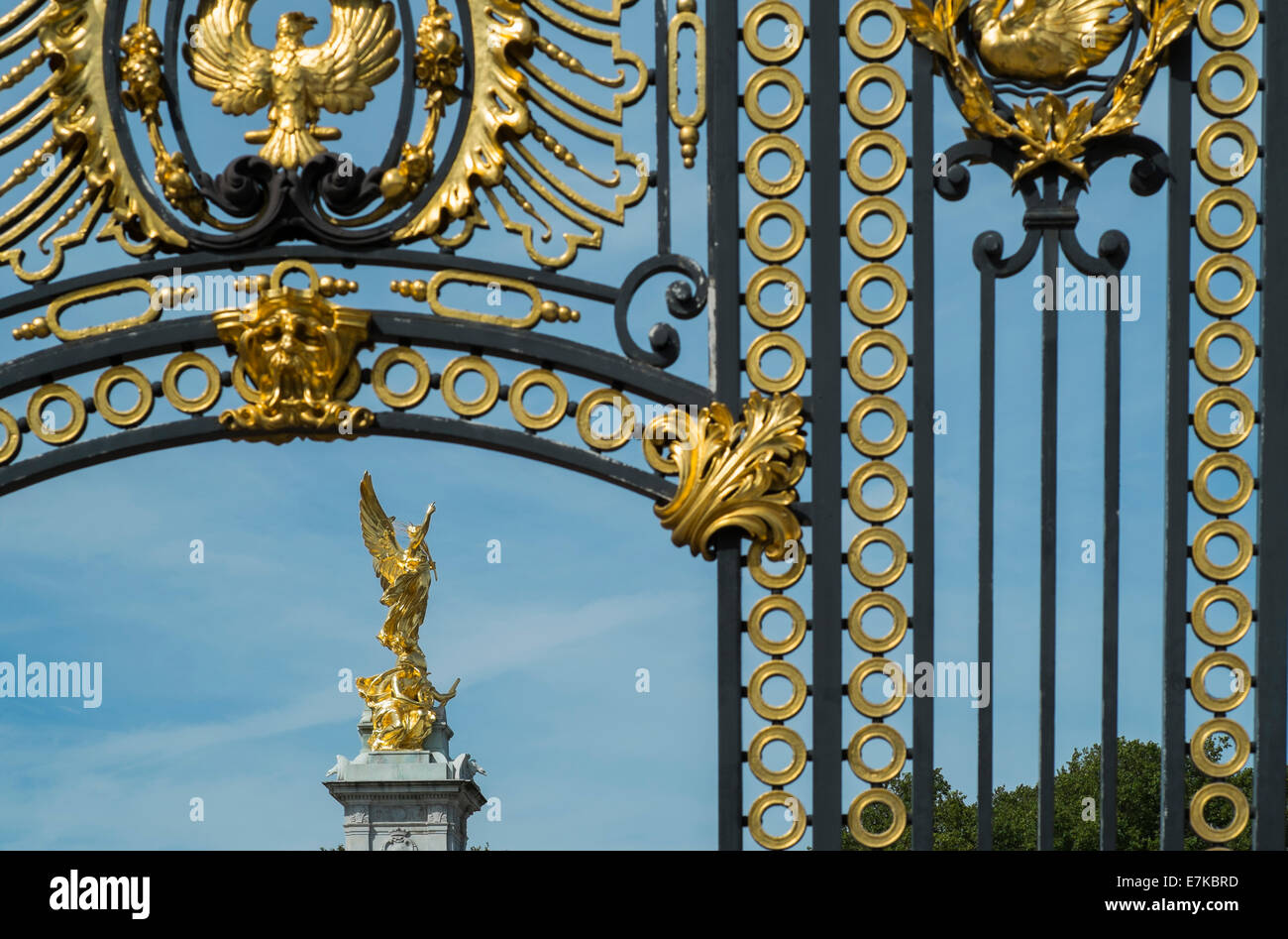 The Victoria Memorial seen through gates near Buckingham Palace on a summers day Stock Photo