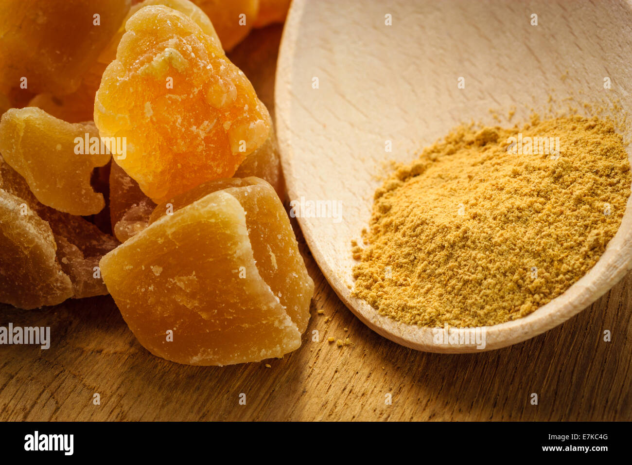 Ginger ground spice and candied on rustic table. Healthy eating, home