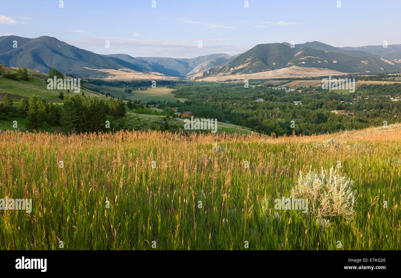 The Beartooth Mountains at dawn with Red Lodge in the middle ground as viewed from the Bear Tooth Pass Highway, Montana, USA. Stock Photo