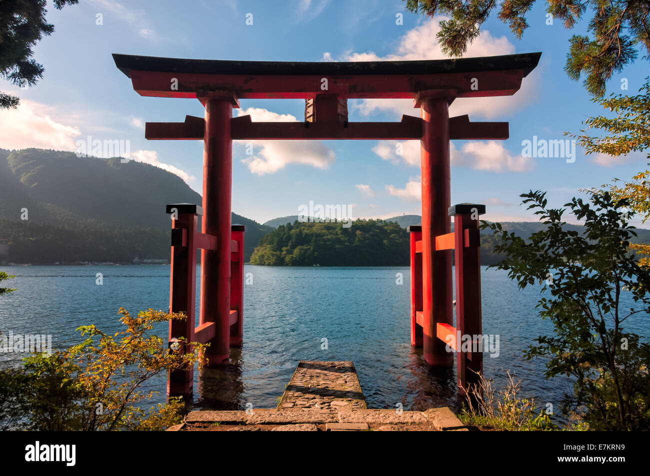 A red torii gate on the shores of Lake Ashi in Hakone, Japan Stock Photo -  Alamy