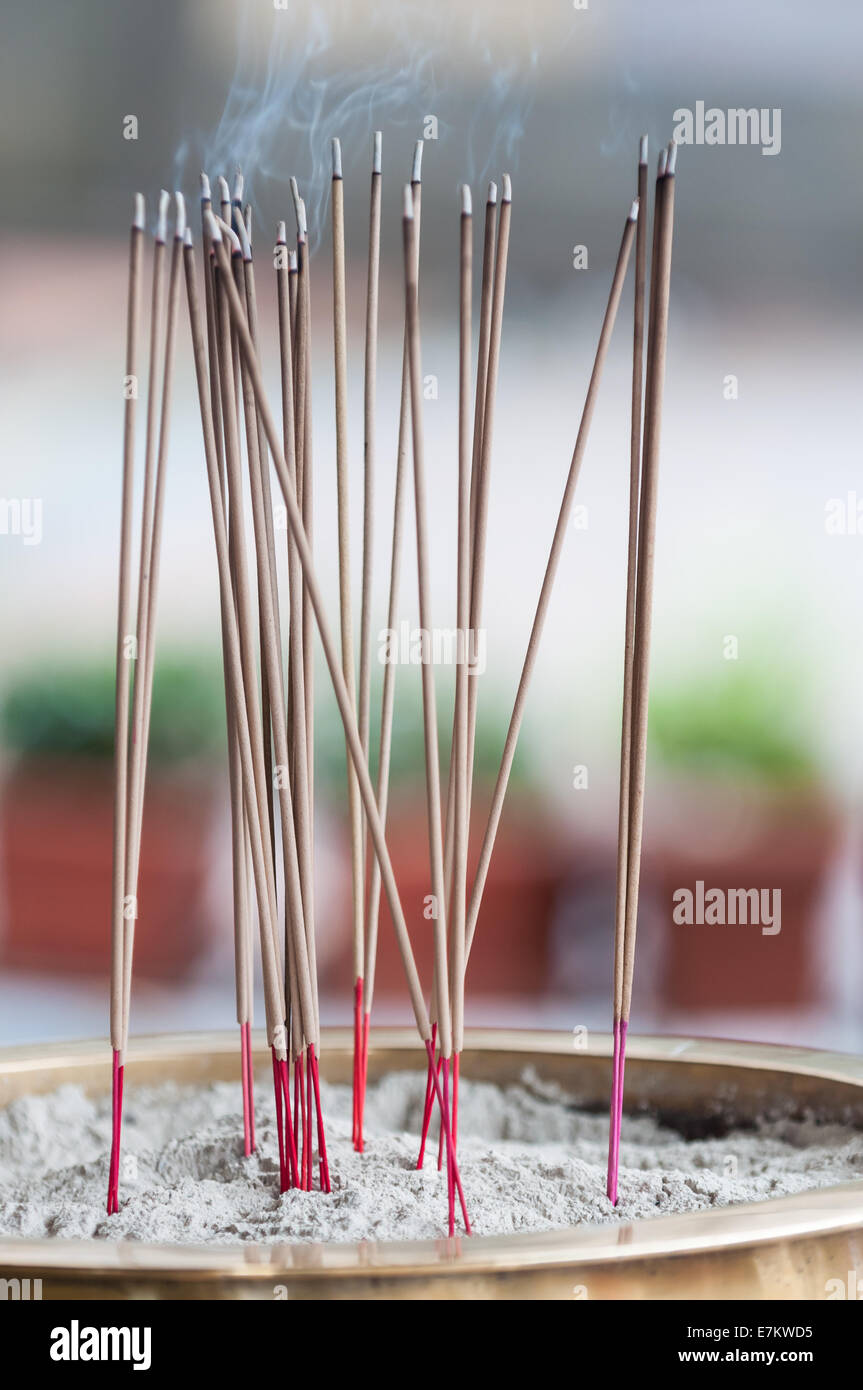 Sticks of incense burn outside of Sri Krishnan Temple in Singapore