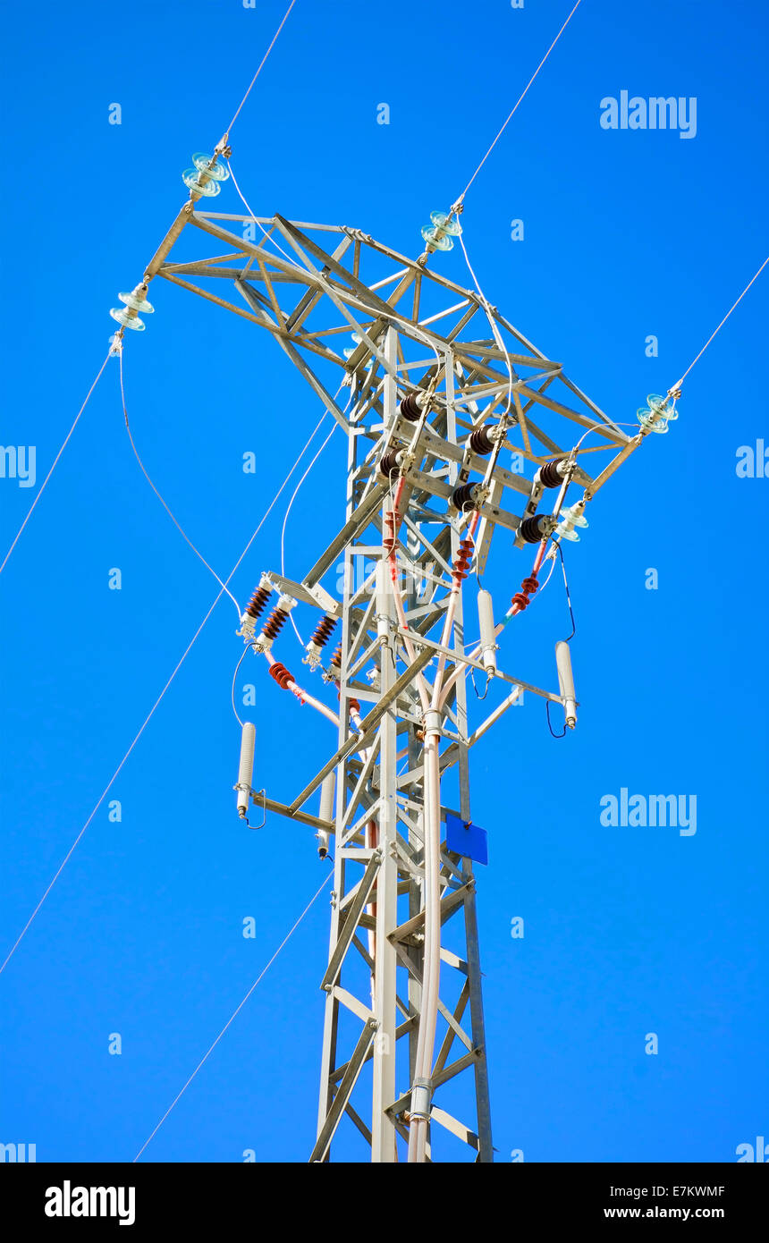 Detailed high voltage power line over brightly blue sky Stock Photo - Alamy