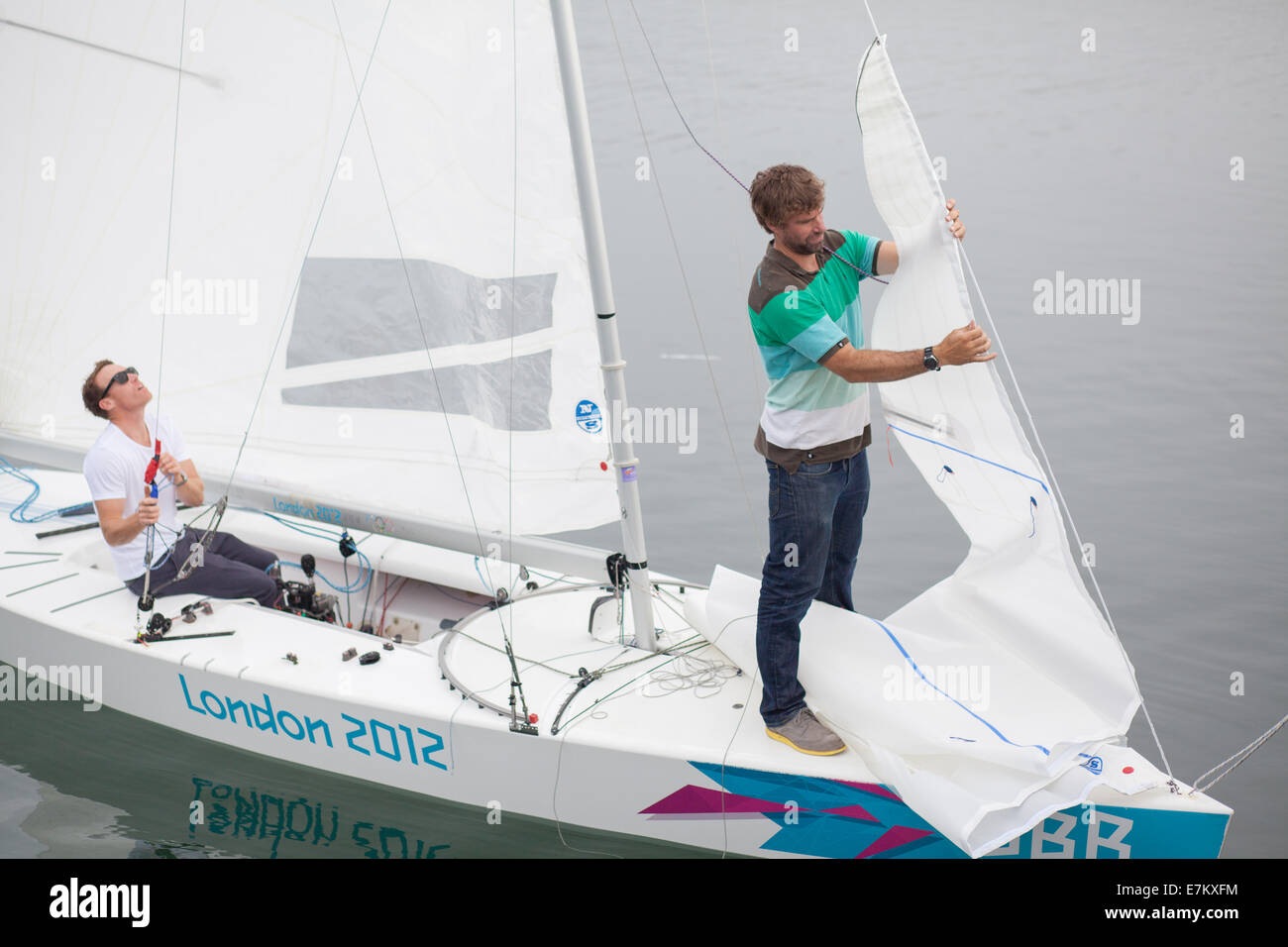 The Andrew Simpson Sailing Centre, Weymouth and Portland National Sailing Academy, Dorset, UK. 20th September, 2014. British gold medalists Paul Goodison MBE (Left) and Iain Percy OBE (Right) preparing for the Bart's Bash sailing event on Sunday 21 September 2014. Credit:  Jak Bennett/Alamy Live News Stock Photo