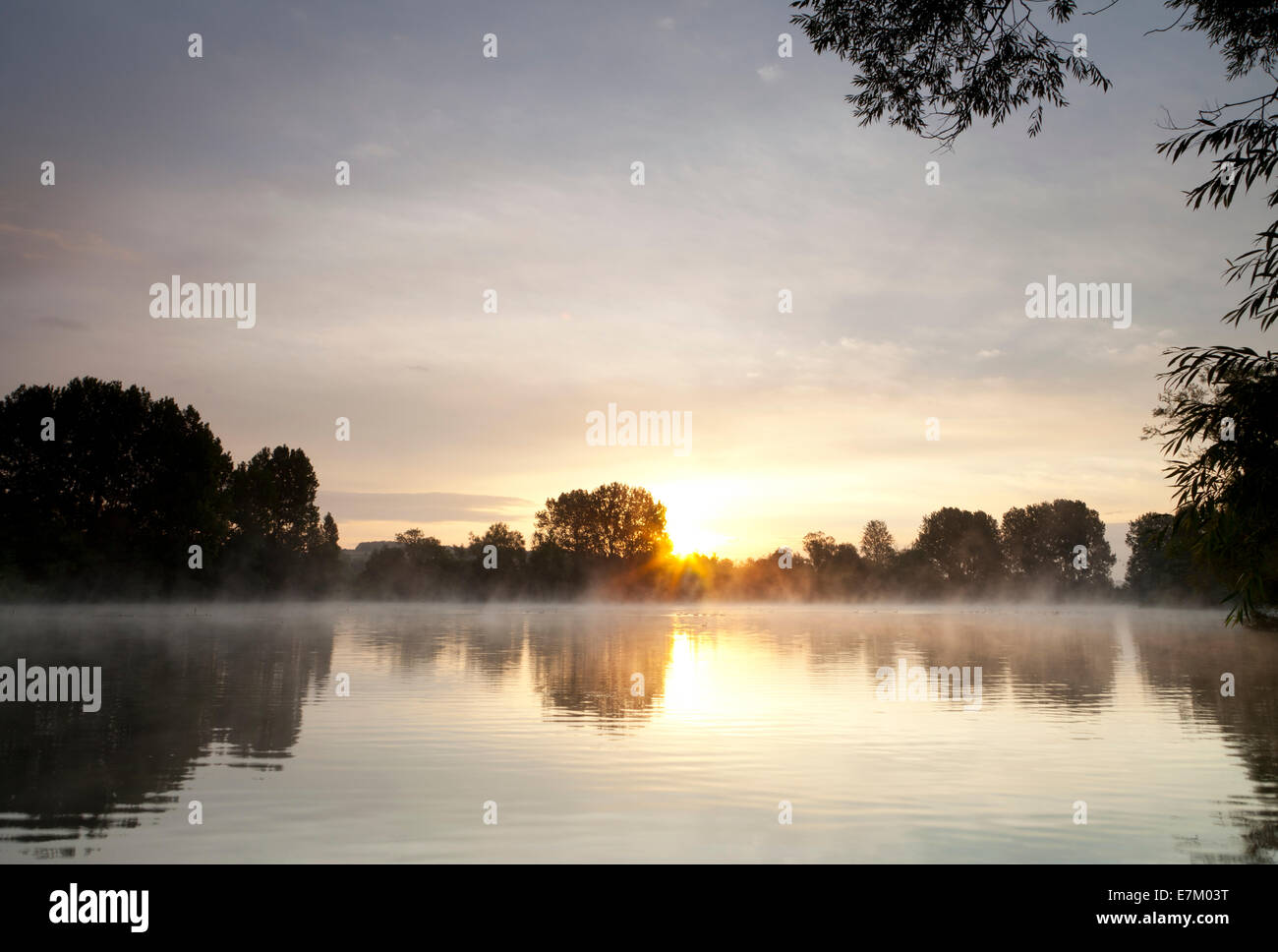 Sunrise at Langford Lakes, at Steeple Langford in Wiltshire. Stock Photo