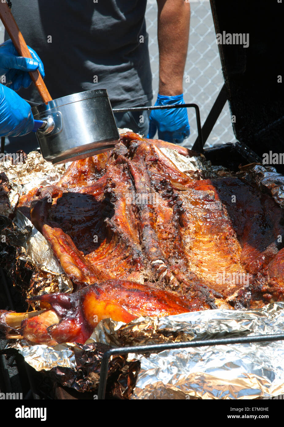 Roasting a suckling pig at Weaverville, CA, US, 2013 Stock Photo