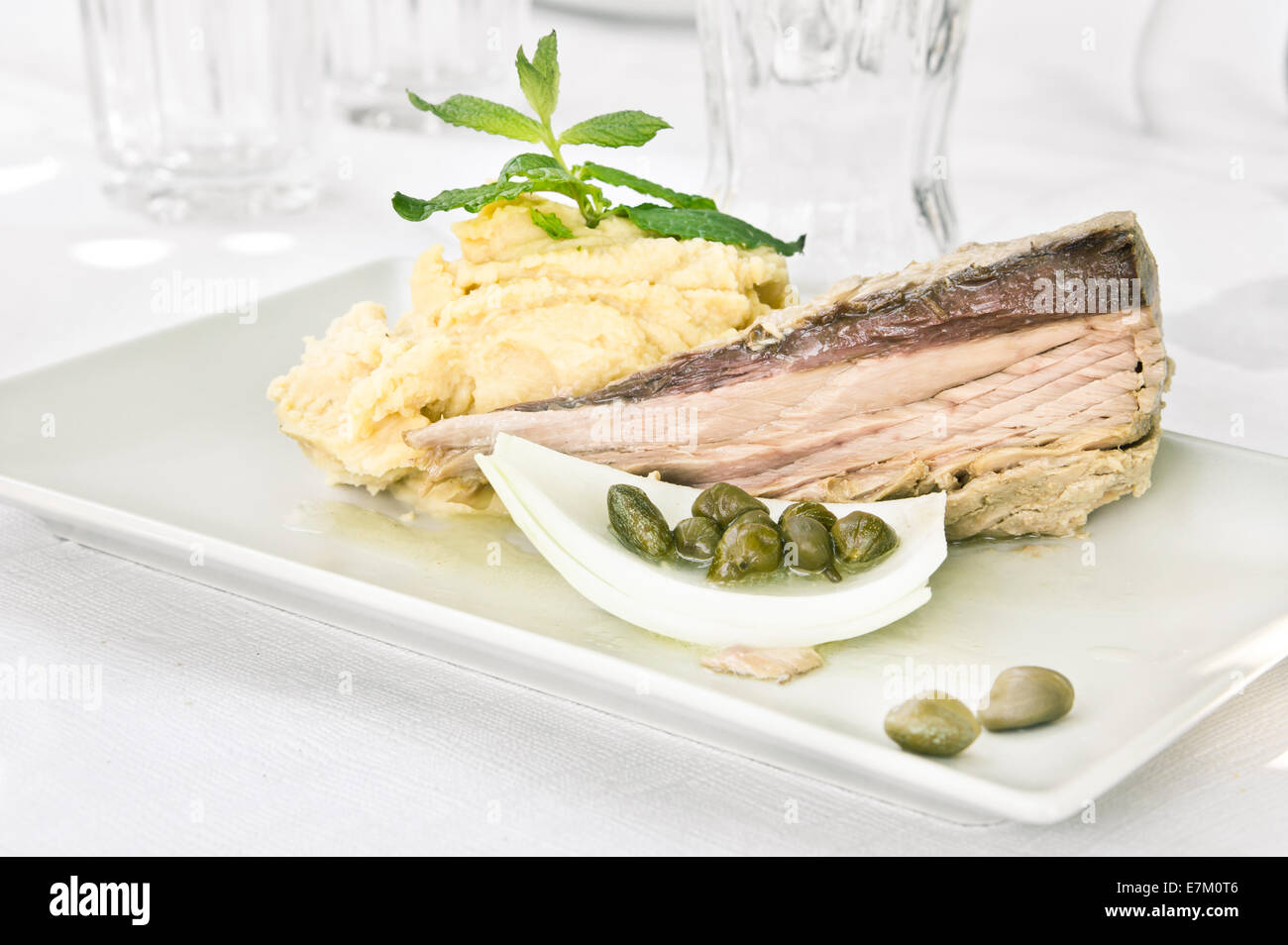 Tuna steak with tahini dip, capers and fresh mint Stock Photo Alamy