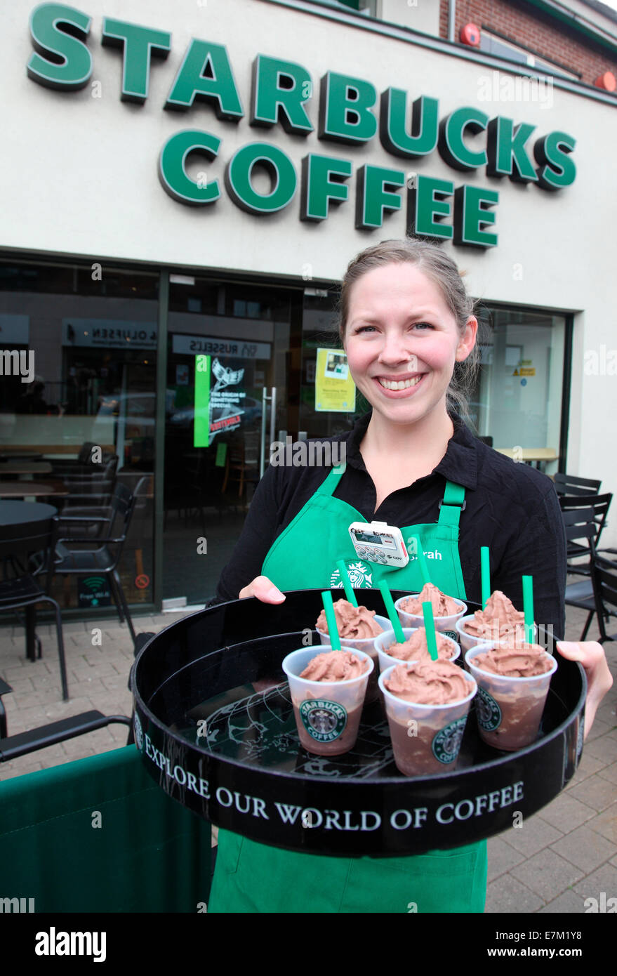 Sarah from Denvers serves frappucinnos at Starbucks, Lisburn Road, Belfast Stock Photo