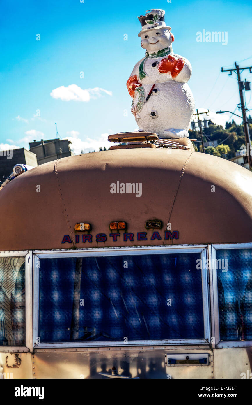 Snowman on top of an Air Stream trailer in Seattle Washington Stock Photo