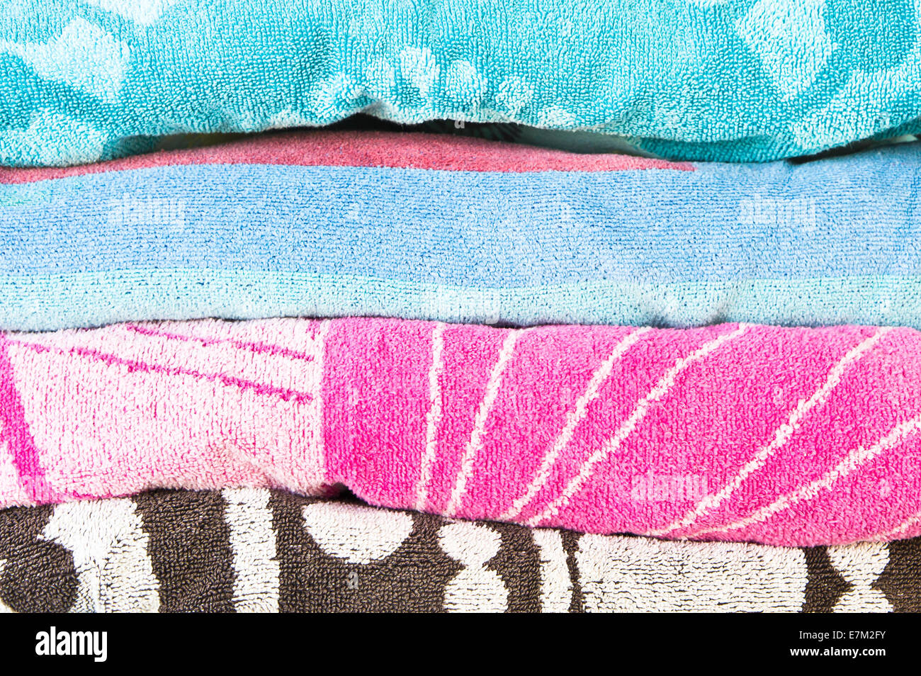 Pile of beach towels as a background image Stock Photo - Alamy